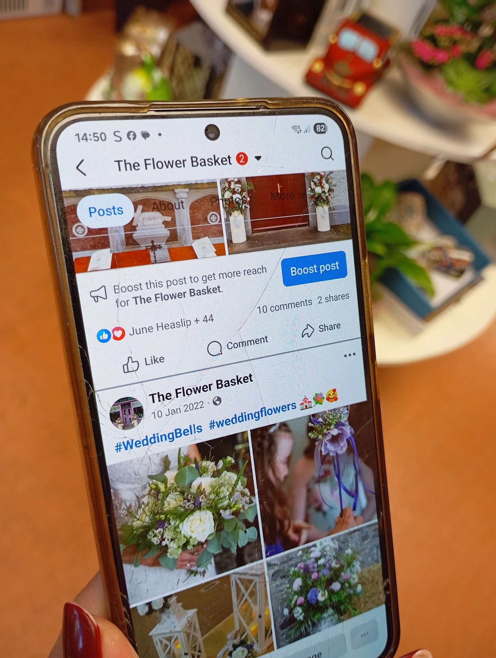 The Flower Basket Facebook page on smartphone