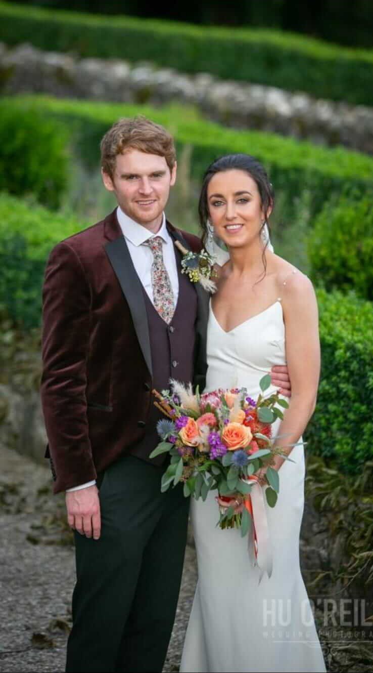 Bride holding bouquet at church entrance